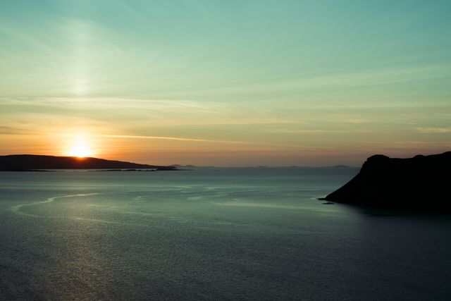 View of a setting sun over the sea in the Skye islands