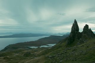 View from the top of a mountain of huge rocks and lochs during a cloudy morning