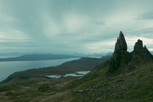 View from the top of a mountain of huge rocks and lochs during a cloudy morning